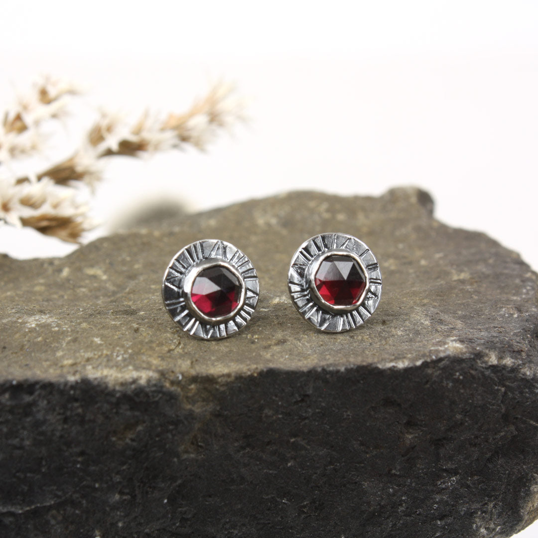 Sterling silver earrings with faceted rose-cut garnets.