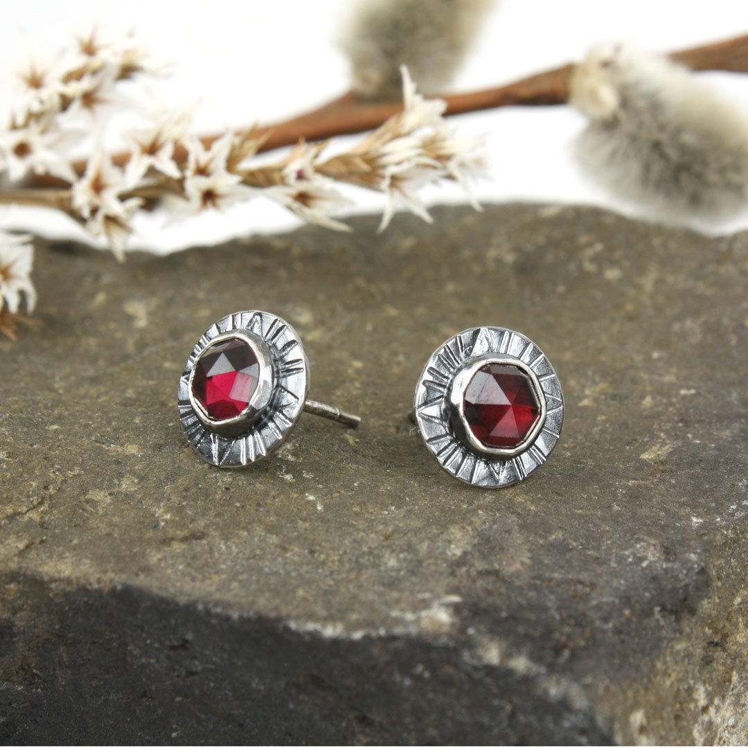 Sterling silver earrings with faceted rose-cut garnets. 