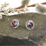 Sterling silver earrings with faceted rose-cut garnets. 