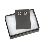 Sterling silver earrings with faceted rose-cut amethyst. Shown displayed in a black gift box.